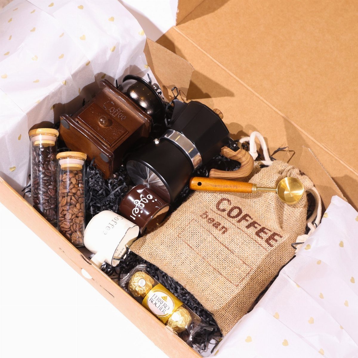 Coffee gift set in a box with grinder, moka pot, and burlap bean bag.