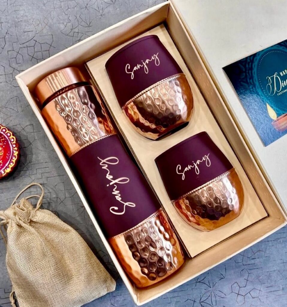 Copper hammered metal bottle and cups set with personalized name in a gift box