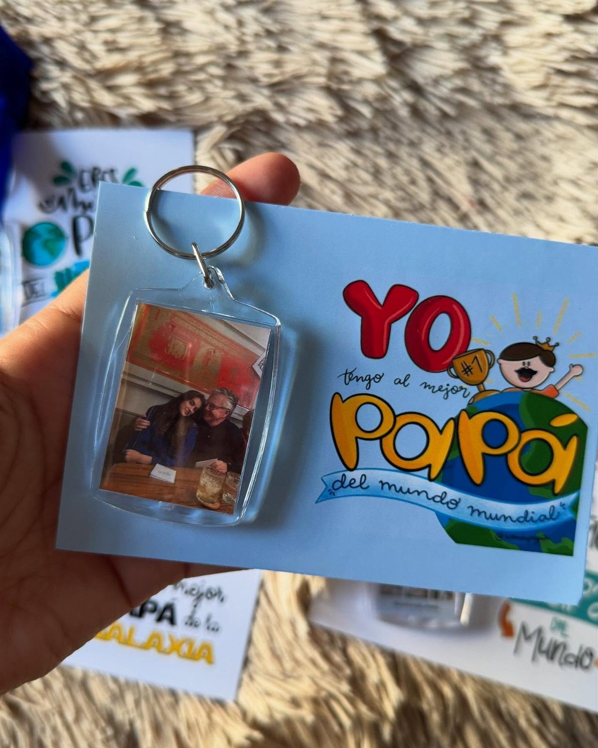 Blue Father's Day card with Spanish text and a custom photo keychain.