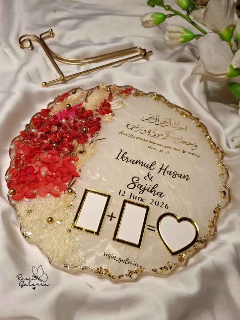 Circular resin wedding gift with red flowers, gold accents, and personalized names.