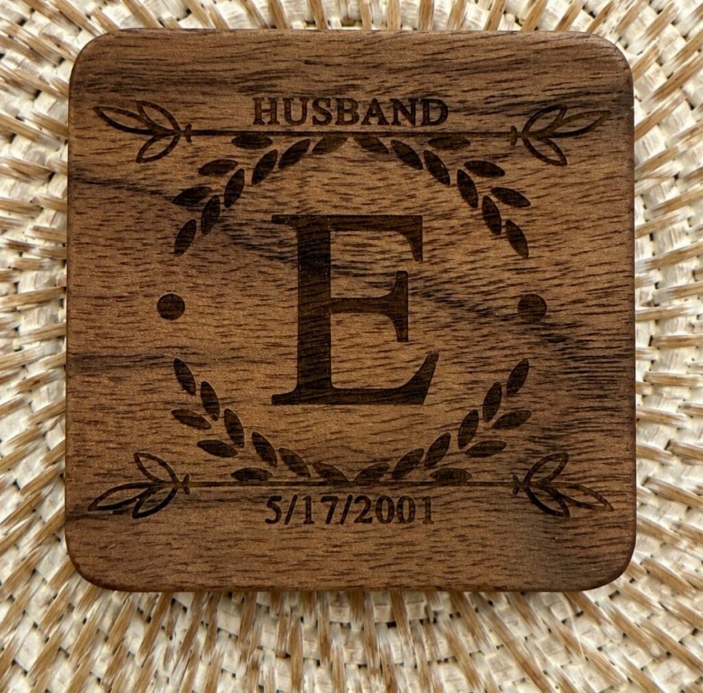 Engraved wooden coaster for a husband with a letter E and anniversary date